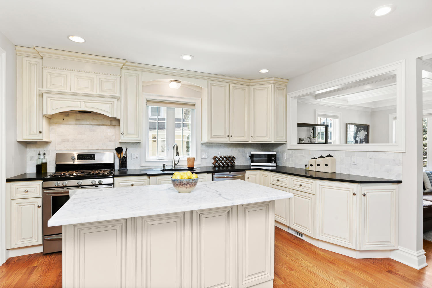 183 Rockland Road Fairfield, CT 06825 - Photo 3 of 27 a kitchen with stainless steel appliances a stove a sink a stove a refrigerator a center island and cabinets