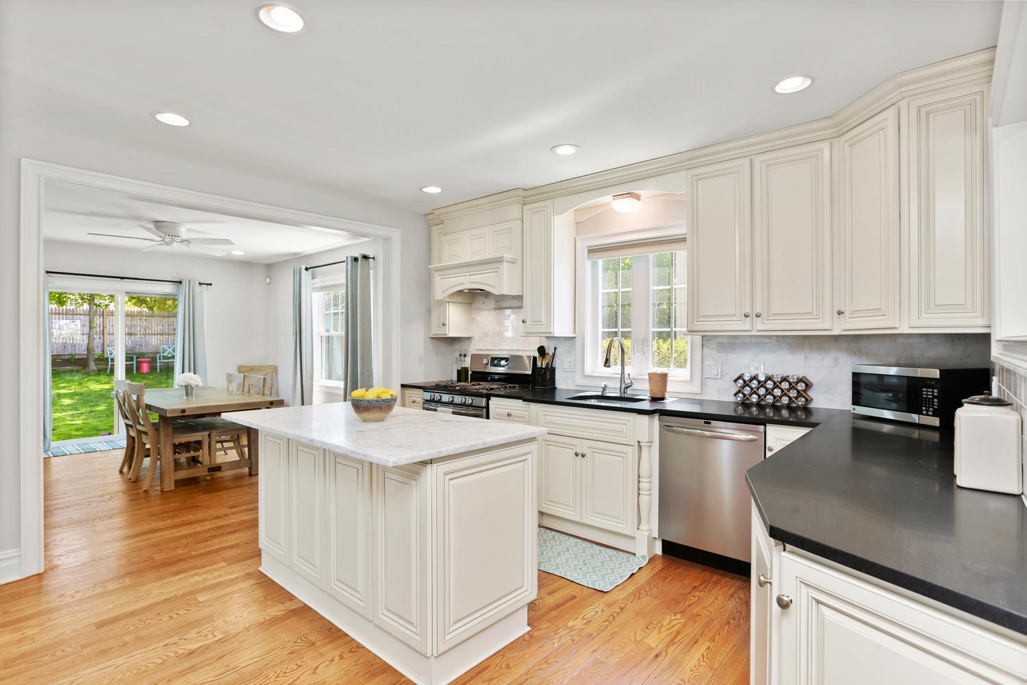 183 Rockland Road Fairfield, CT 06825 - Photo 5 of 27 a kitchen with stainless steel appliances granite countertop sink stove top oven and cabinets