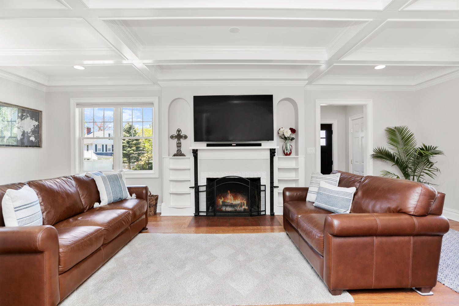 183 Rockland Road Fairfield, CT 06825 - Photo 7 of 27 a living room with furniture a flat screen tv and a fireplace