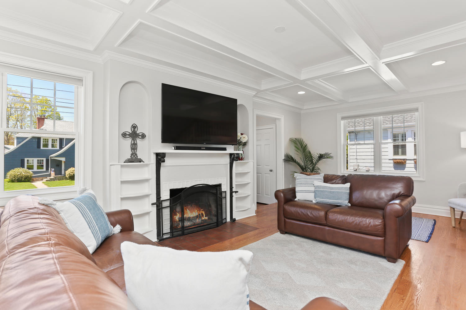183 Rockland Road Fairfield, CT 06825 - Photo 8 of 27 a living room with furniture a fireplace a flat screen tv and a large window