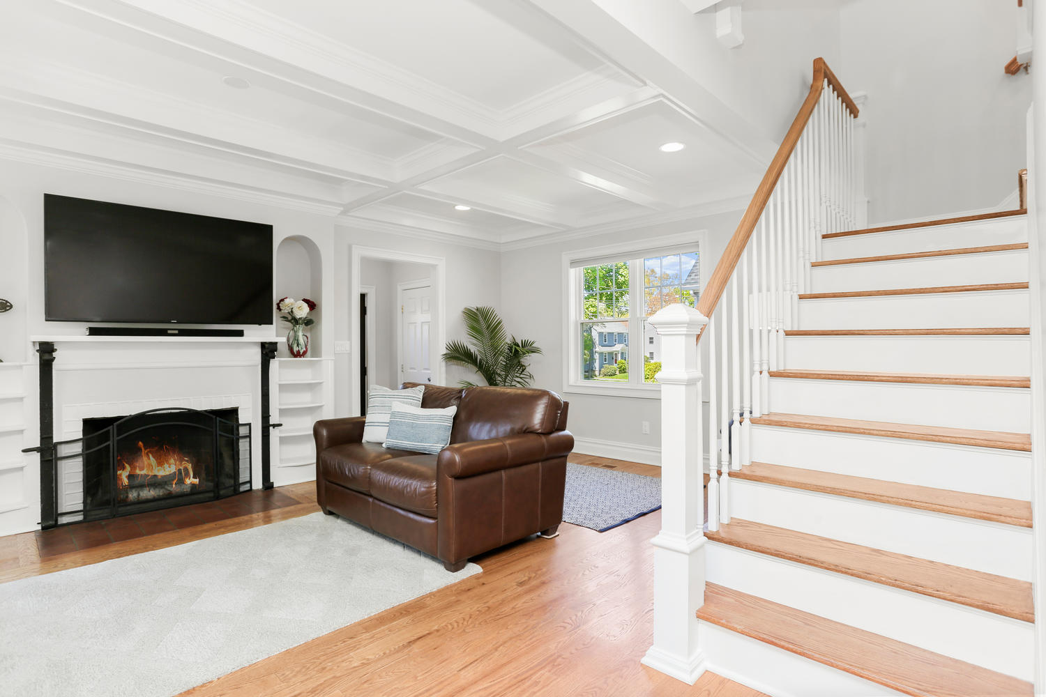 183 Rockland Road Fairfield, CT 06825 - Photo 9 of 27 a living room with furniture and a fireplace