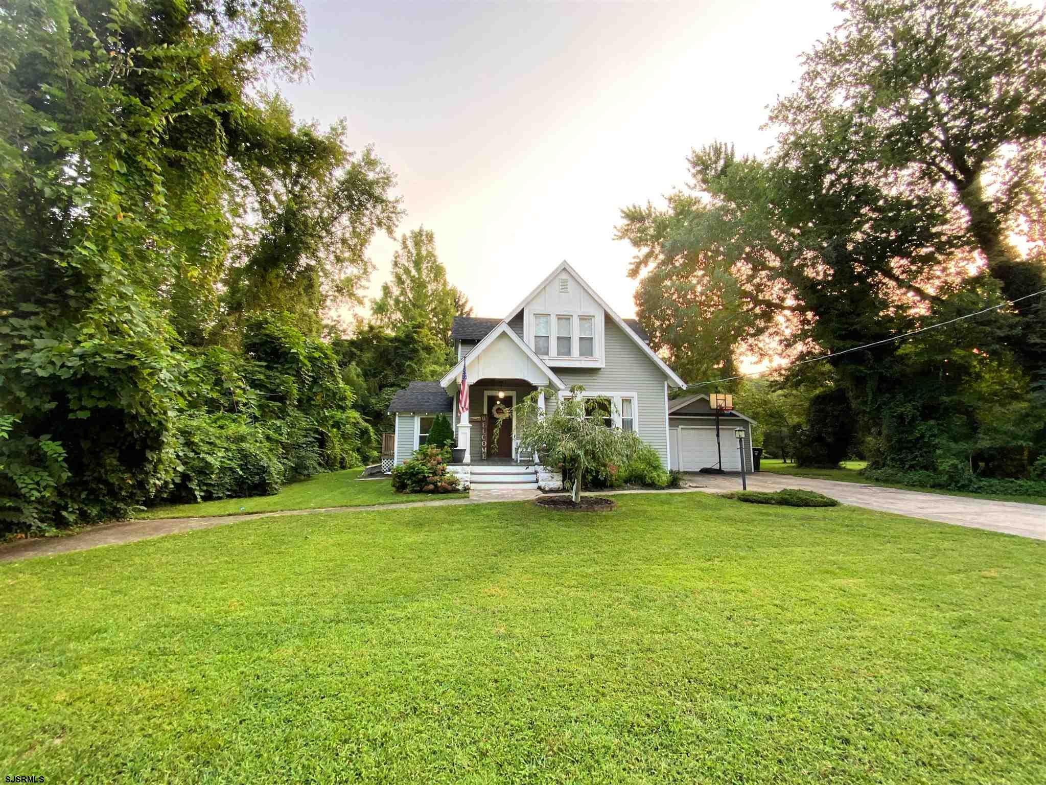 220 West Mill Road Northfield, NJ 08225 - Photo 1 of 22 a big house with a big yard and large trees