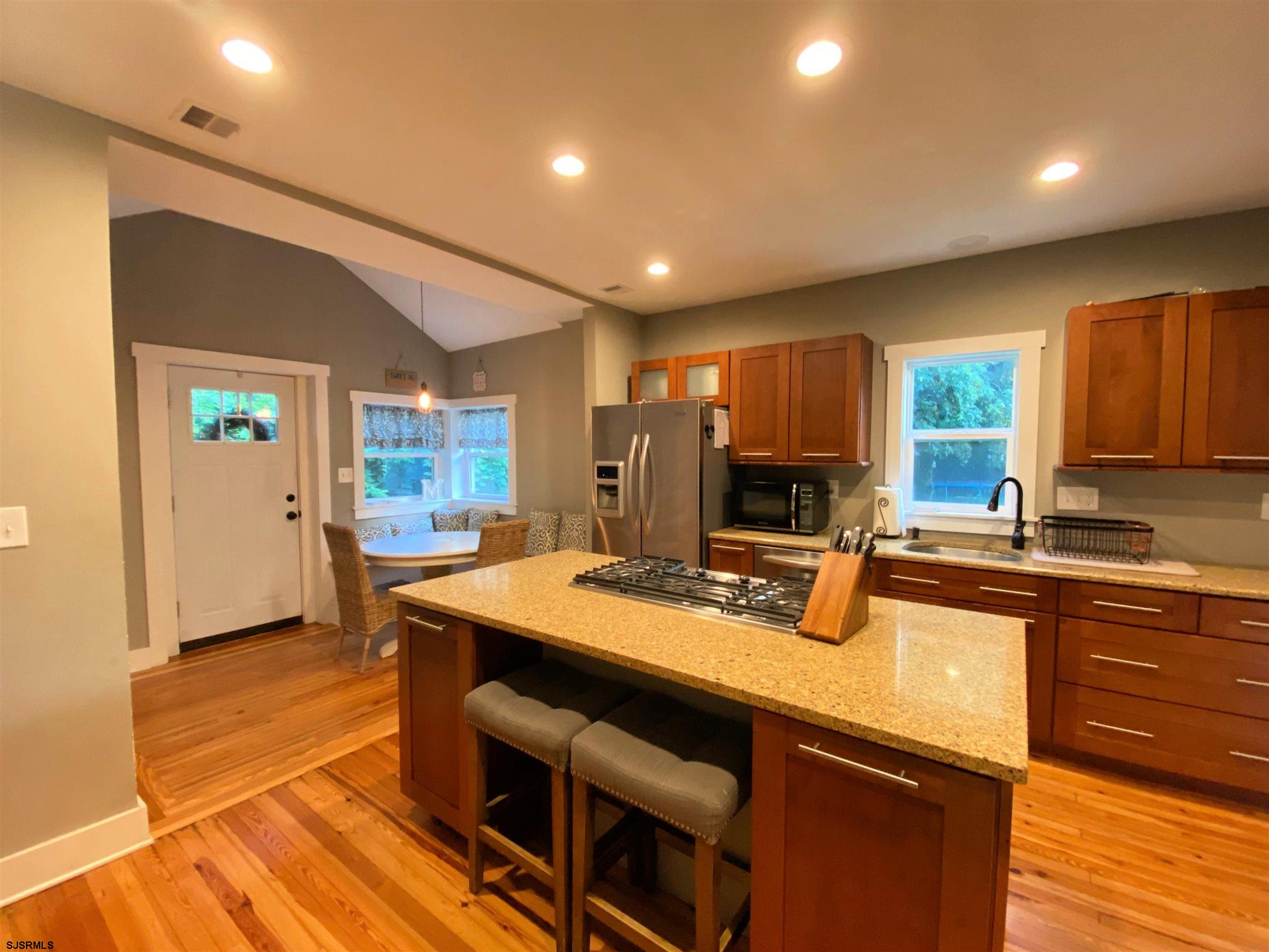 220 West Mill Road Northfield, NJ 08225 - Photo 3 of 22 a kitchen with sink and refrigerator