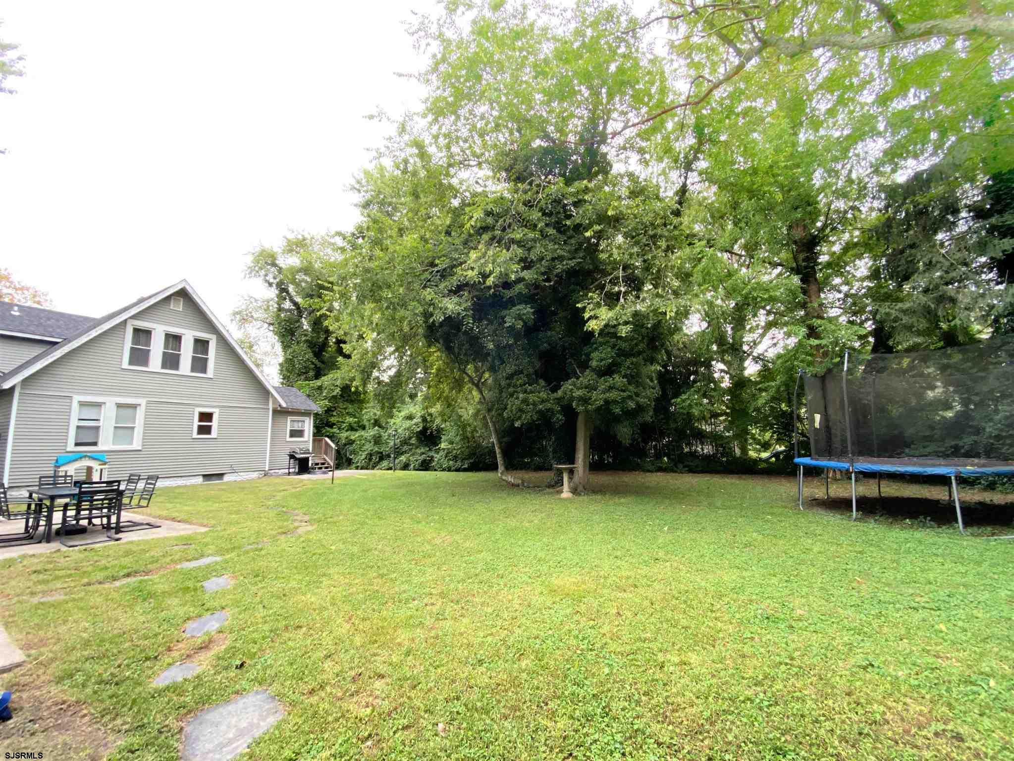 220 West Mill Road Northfield, NJ 08225 - Photo 22 of 22 a view of a house with a yard and sitting area