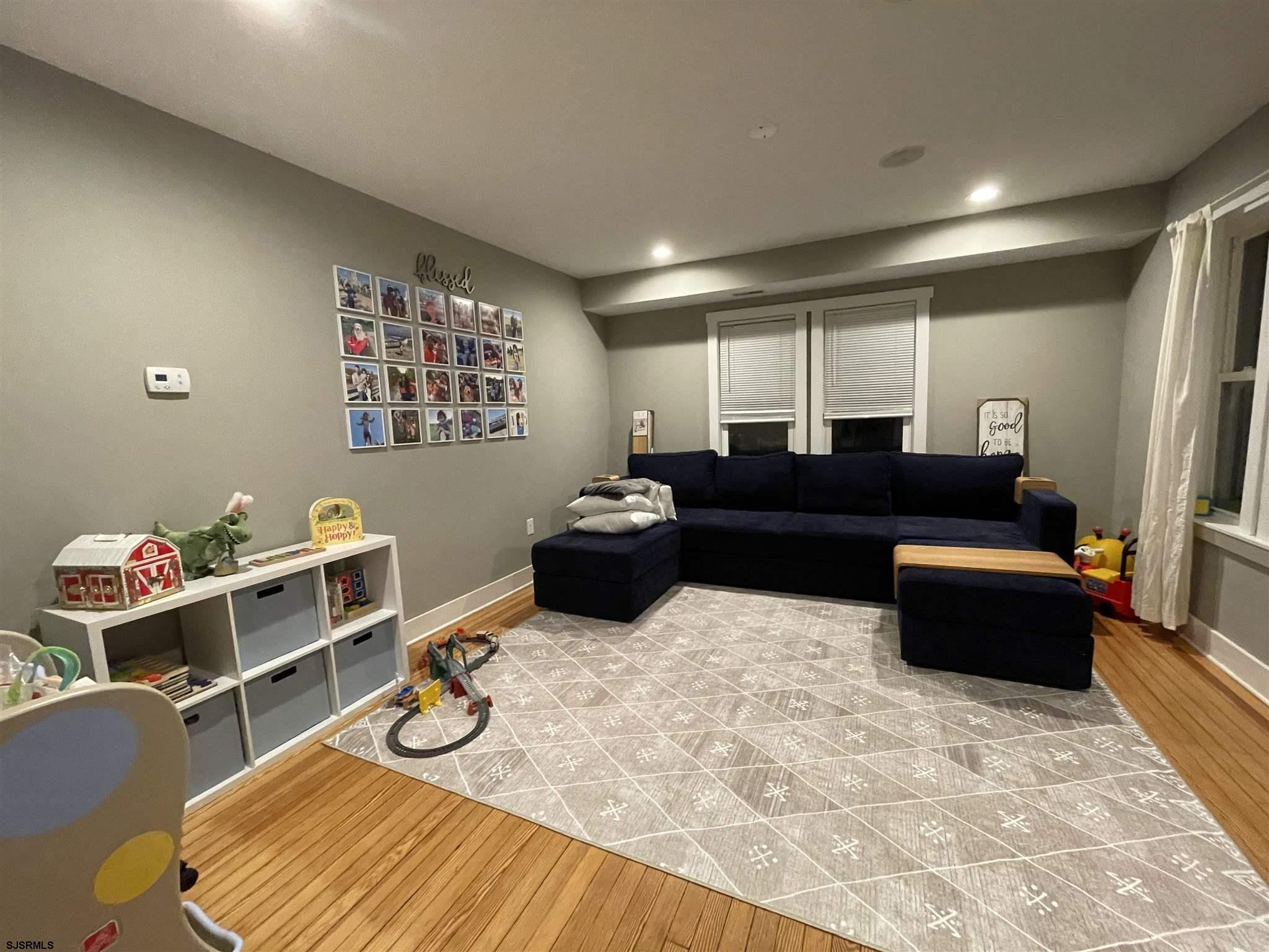 220 West Mill Road Northfield, NJ 08225 - Photo 7 of 22 a living room with furniture and wooden floor