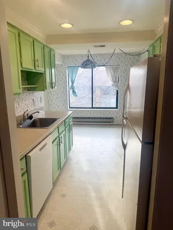 a utility room with a sink a washer and dryer