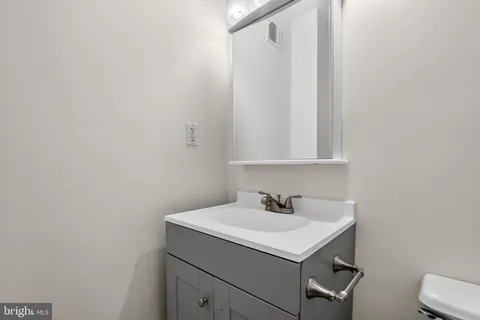 a bathroom with a sink and mirror