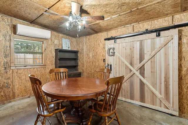 a dining room with furniture and window