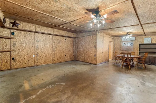 a view of a livingroom with furniture and a ceiling fan