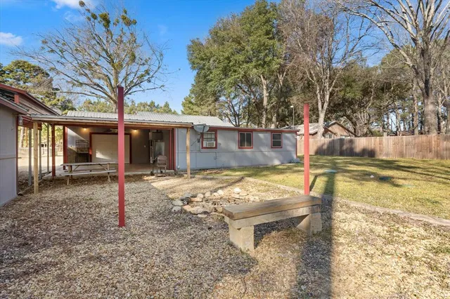 a view of a park with large trees