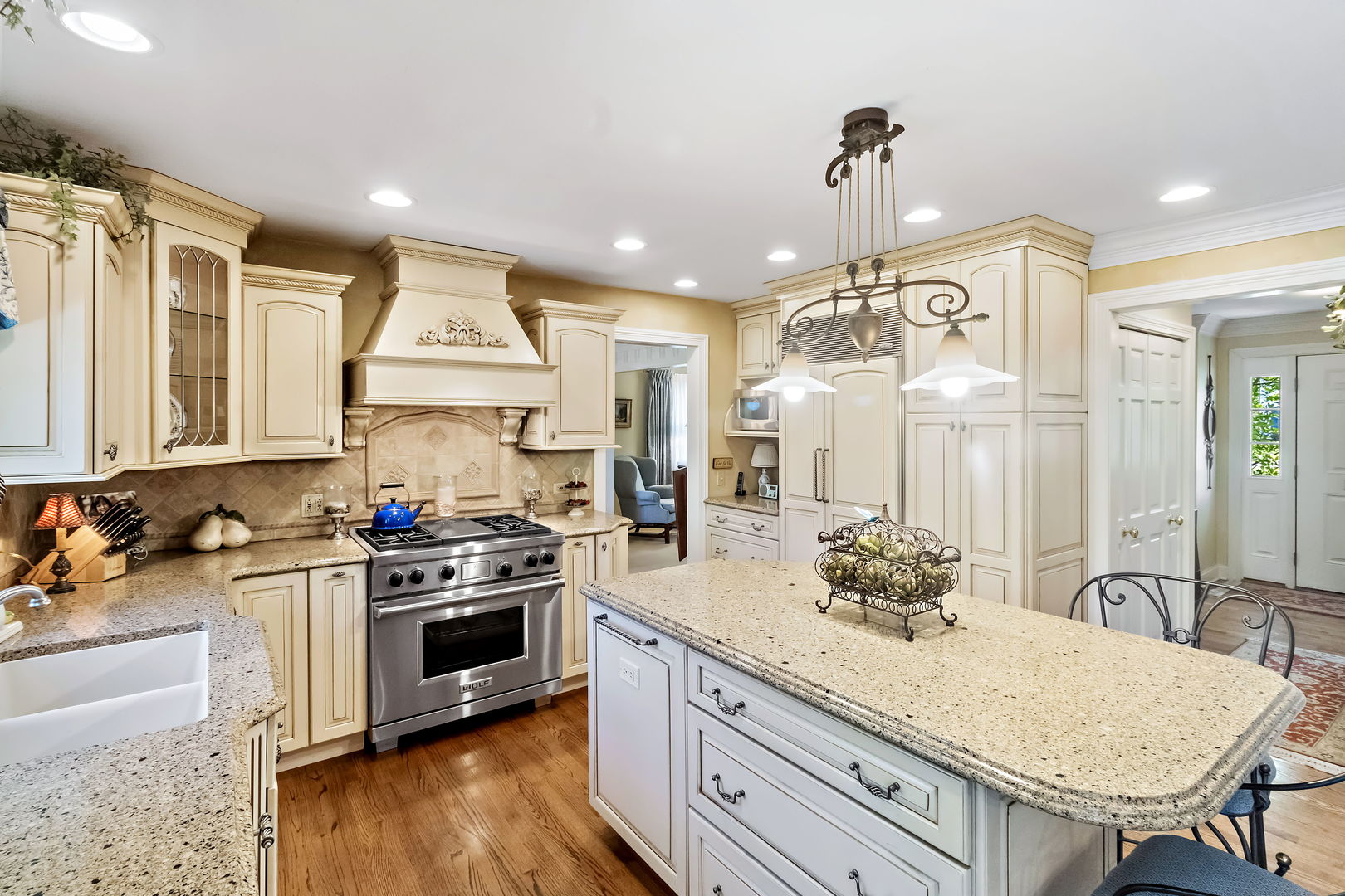 1219 Howard Circle Wheaton, IL 60187 - Photo 12 of 26 a kitchen with a stove a sink and a refrigerator