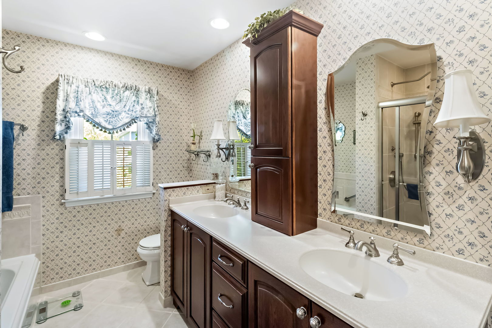1219 Howard Circle Wheaton, IL 60187 - Photo 14 of 26 a bathroom with a double vanity sink mirror and toilet