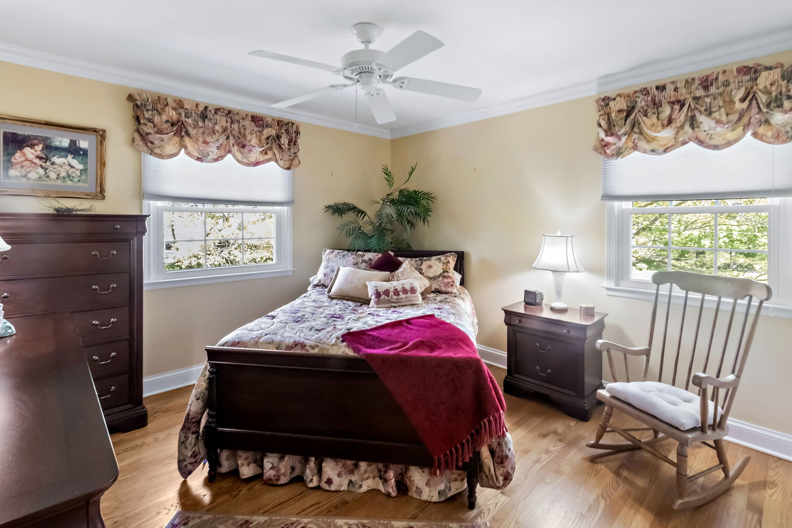 1219 Howard Circle Wheaton, IL 60187 - Photo 16 of 26 a bedroom that has a bed and a chair in it