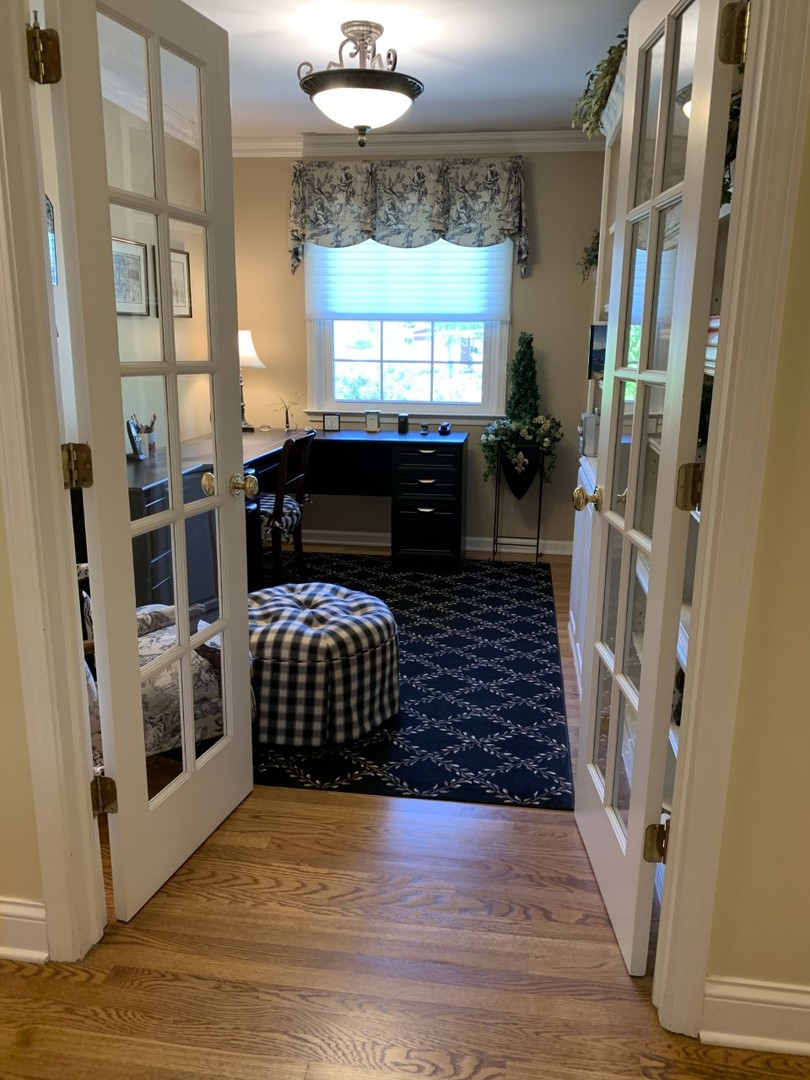 1219 Howard Circle Wheaton, IL 60187 - Photo 18 of 26 a view of a furniture in a room with a window and wooden floor
