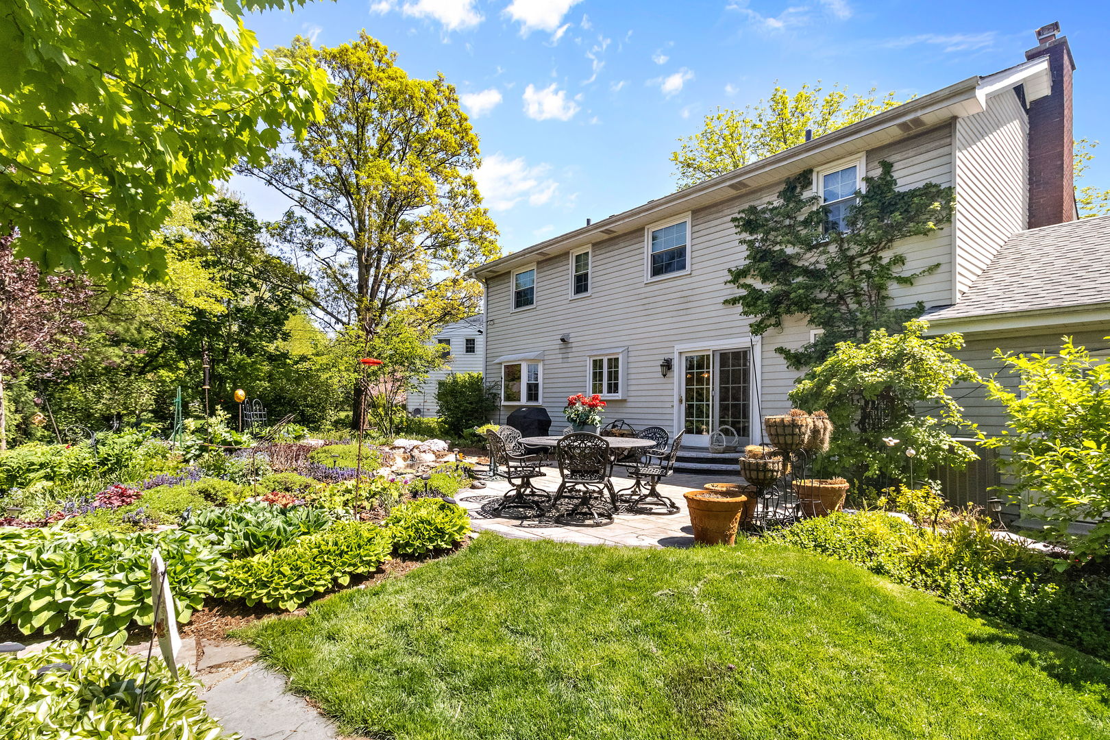 1219 Howard Circle Wheaton, IL 60187 - Photo 25 of 26 a view of a patio with chair and tables back yard of the house