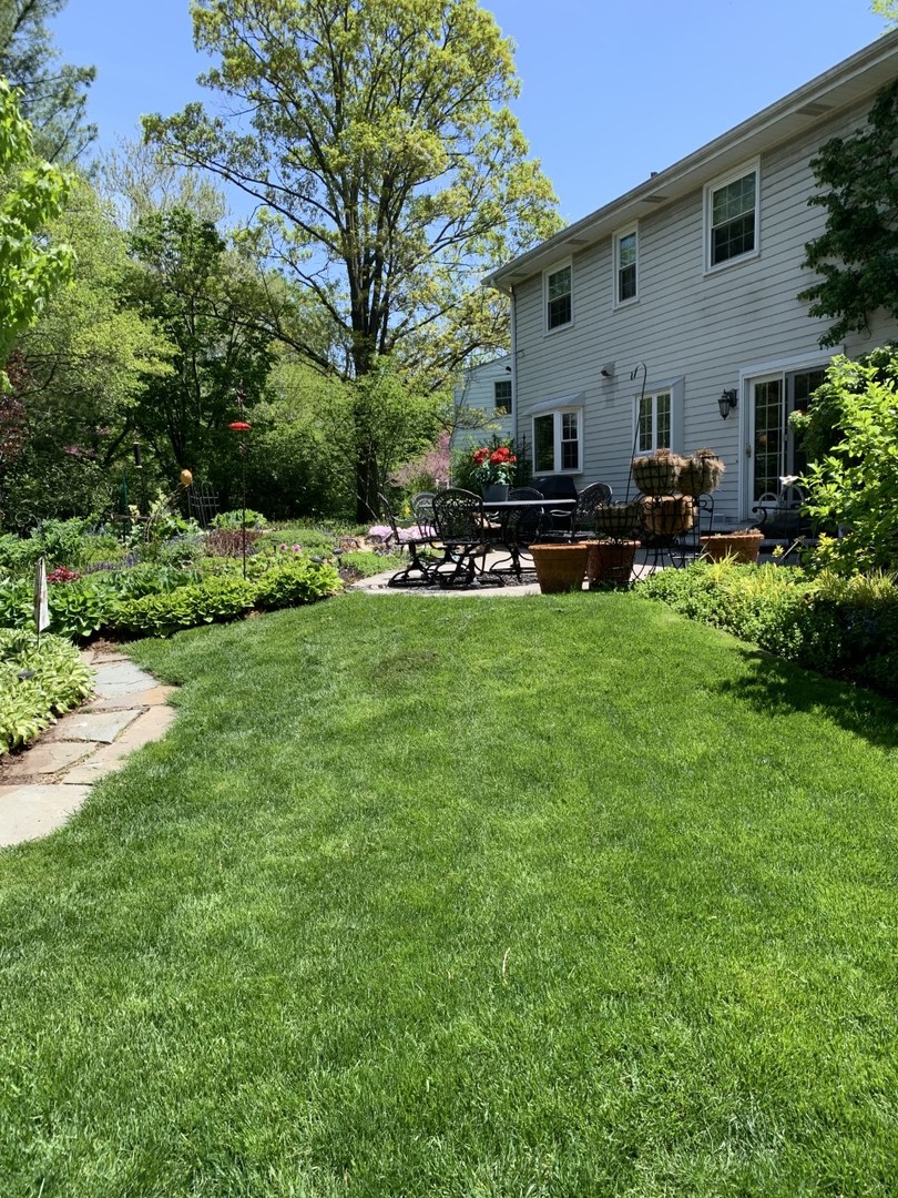 1219 Howard Circle Wheaton, IL 60187 - Photo 26 of 26 a view of a backyard with sitting area and garden