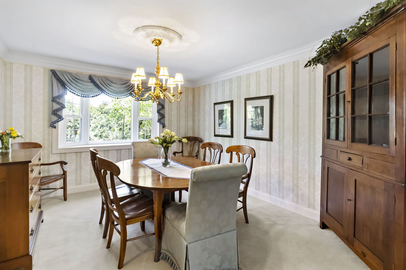 1219 Howard Circle Wheaton, IL 60187 - Photo 6 of 26 a dining room with furniture a chandelier and window