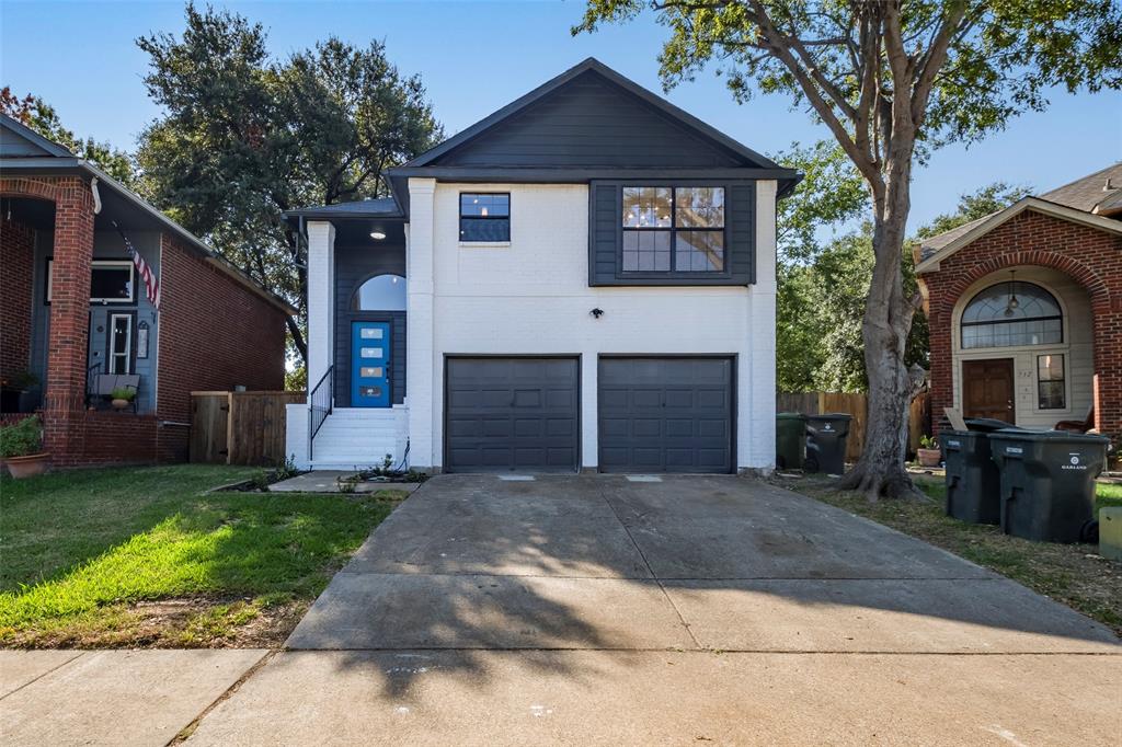 730 Santiago Drive Garland, TX 75043 - Photo 1 of 1 a front view of a house with a yard and garage