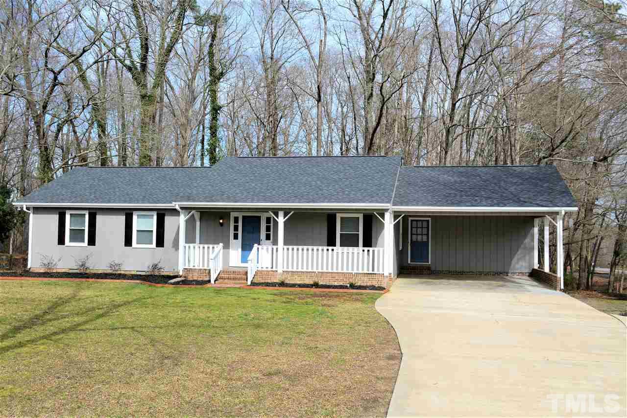 7249 Rock Service Station Road Raleigh, NC 27603 - Photo 1 of 25 Beautiful updated new one story on picturesque Acre lot-no city taxes-yet convenient to everything*New designer paint, new 30 Yr roof, large double carport + storage*extra paved parking*no water bills*You will love all the new updates-schedule today!