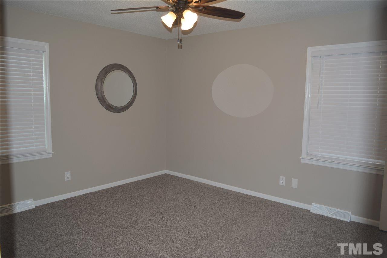 7249 Rock Service Station Road Raleigh, NC 27603 - Photo 14 of 25 Beautiful with new paint, new plush carpet, private luxury new bathroom.