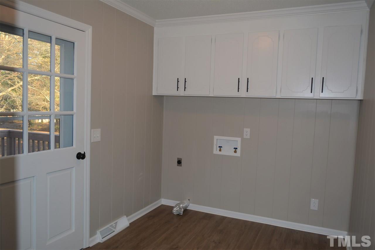 7249 Rock Service Station Road Raleigh, NC 27603 - Photo 18 of 25 So spacious, new paint and flooring, newly painted cabinets, access to your large deck.