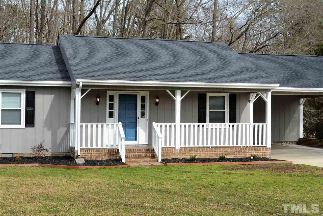 7249 Rock Service Station Road Raleigh, NC 27603 - Photo 3 of 25 Relax & enjoy your beautiful mature landscapes and curb appeal from your large front porch!