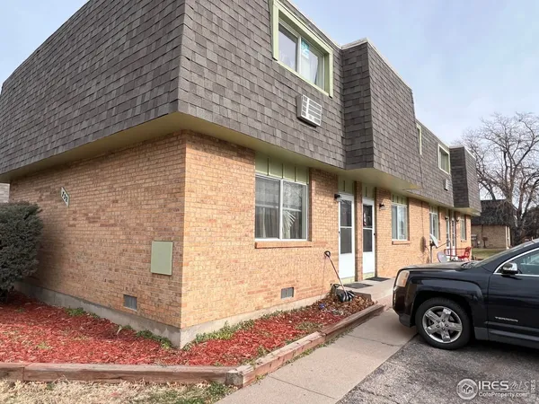 a front view of a house with parking