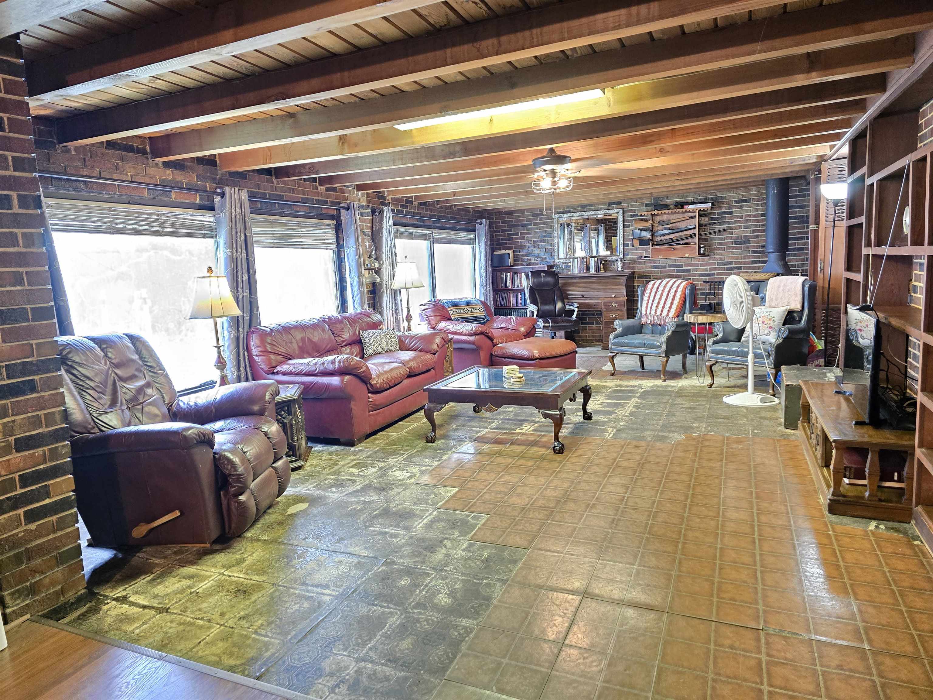 4885 Macon Road Memphis, TN 38122 - Photo 29 of 39 a living room with lots of furniture and a chandelier