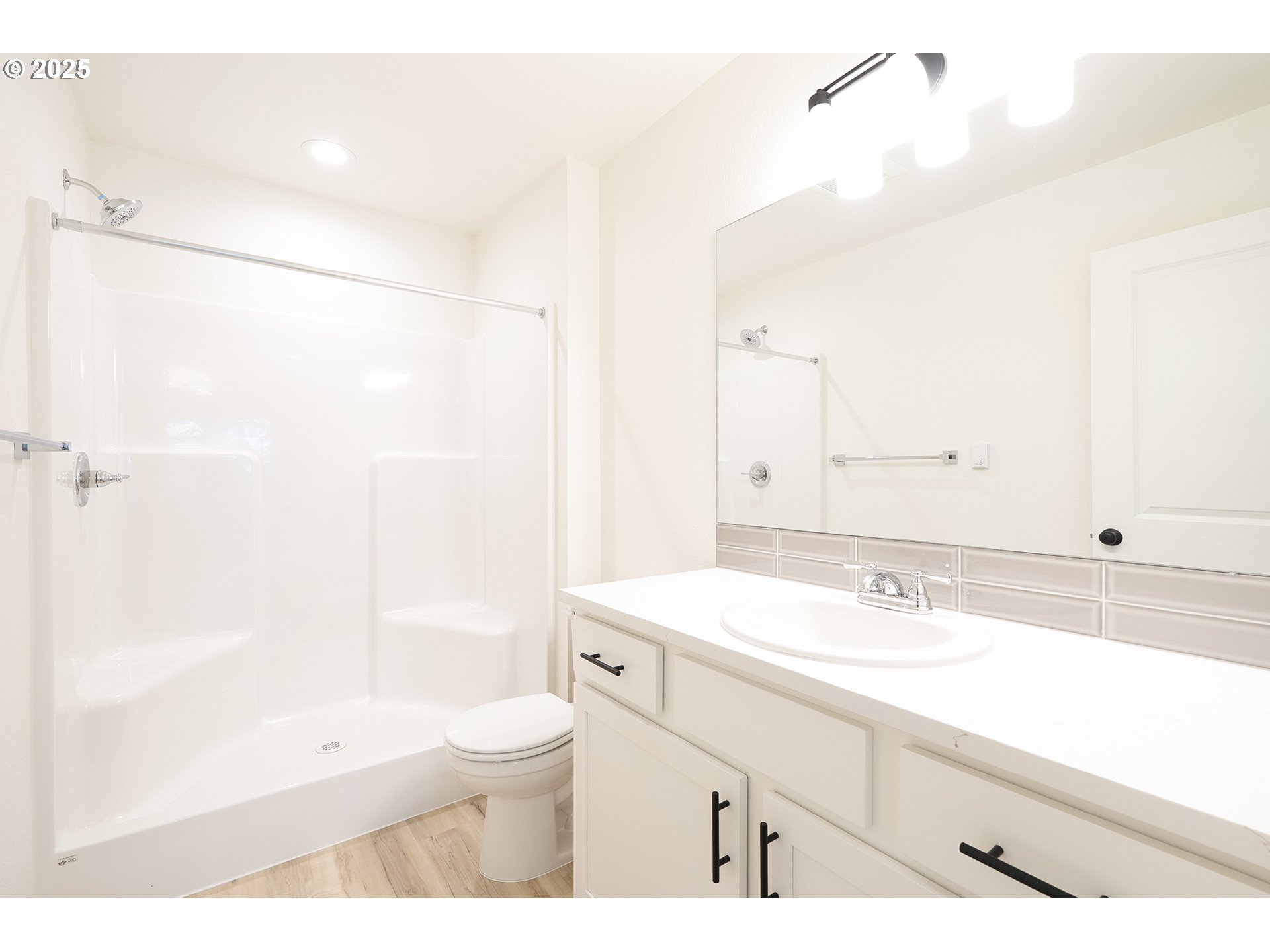 14720 Southeast Powell Boulevard Portland, OR 97236 - Photo 11 of 16 a bathroom with a sink a toilet and shower