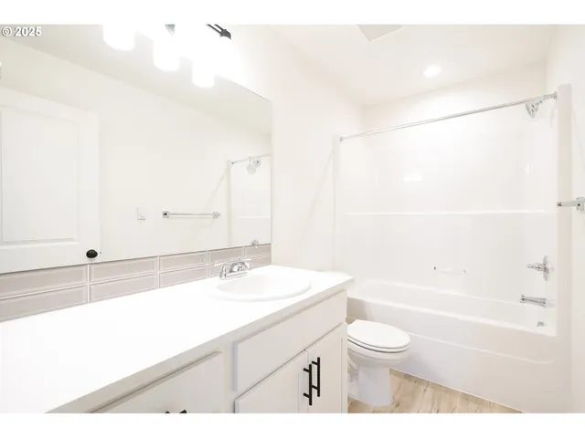 a view of a backyard with wooden fence