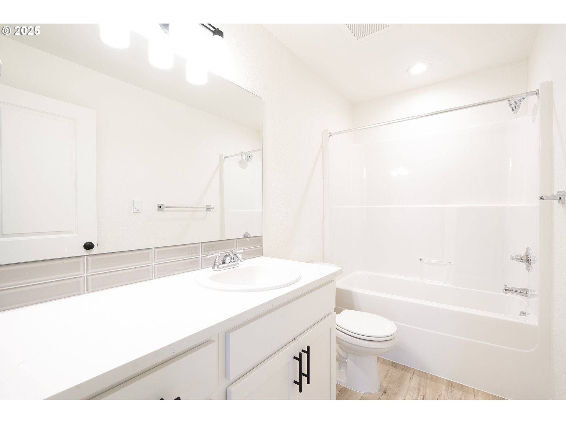 14720 Southeast Powell Boulevard Portland, OR 97236 - Photo 14 of 16 a bathroom with a sink a toilet and a bathtub
