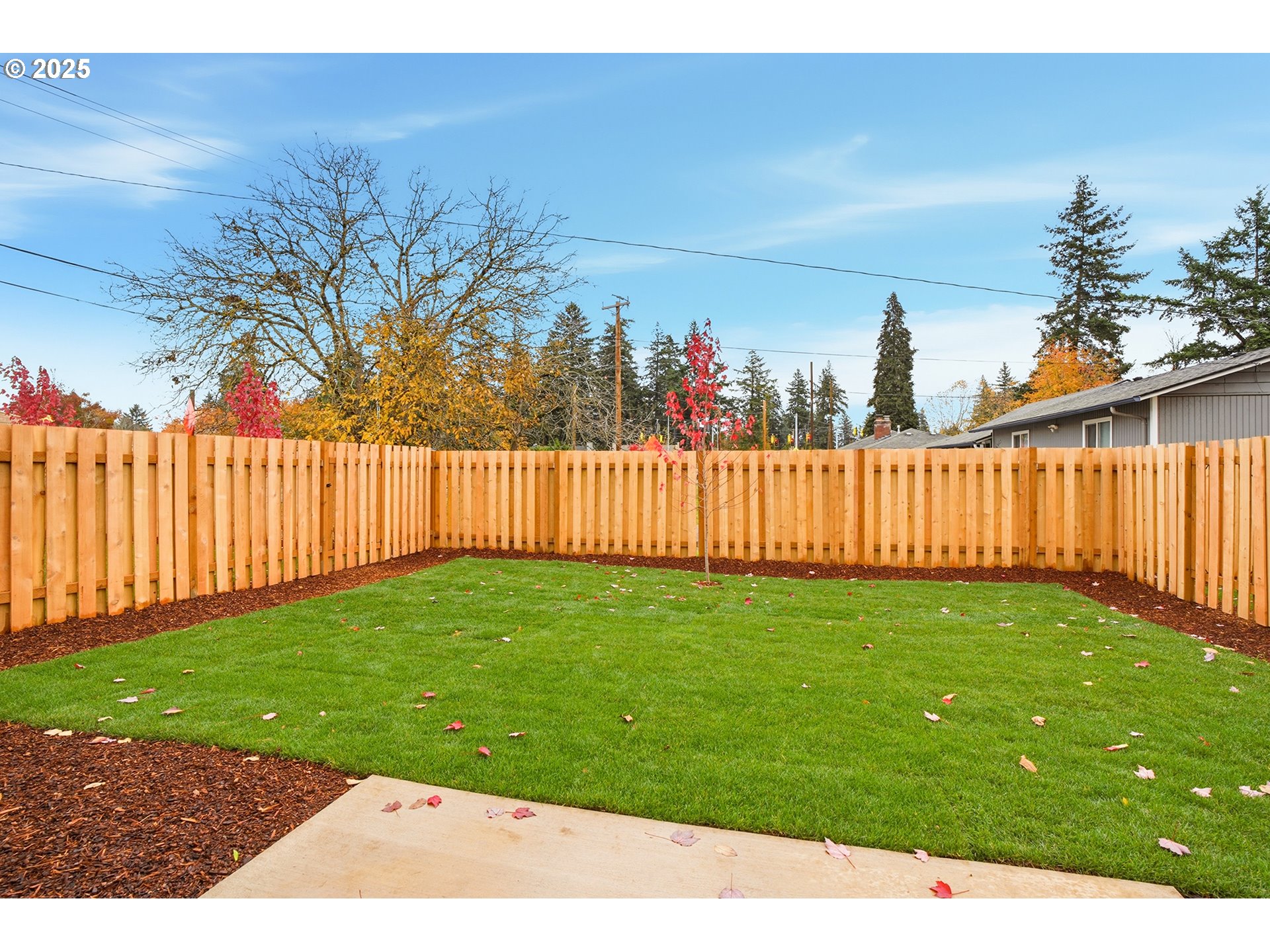 14720 Southeast Powell Boulevard Portland, OR 97236 - Photo 15 of 16 a view of a backyard with wooden fence