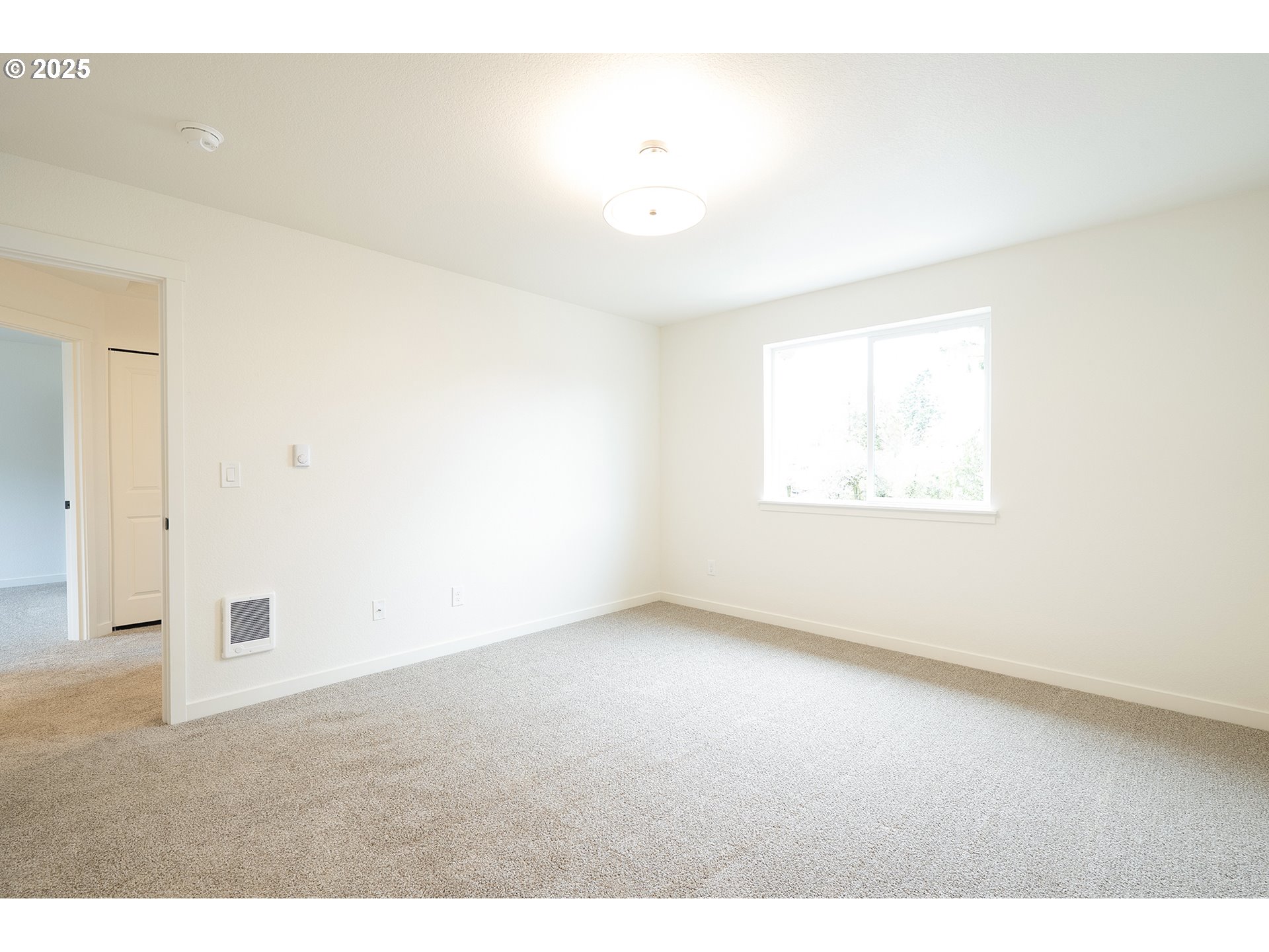 14720 Southeast Powell Boulevard Portland, OR 97236 - Photo 9 of 16 an empty room with windows