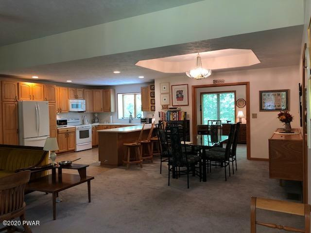116 Maple Ridge Drive Hawley, PA 18428 - Photo 19 of 19 a view of a dining room with furniture and window