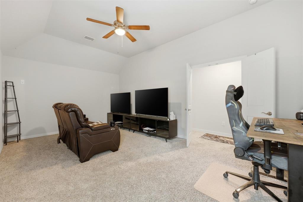 418 Crestview Drive Midlothian, TX 76065 - Photo 30 of 39 Media room - Theater with light colored carpet, ceiling fan, and lofted ceiling