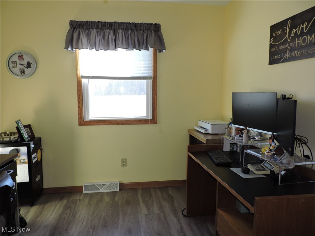 42059 Biggs Road Lagrange, OH 44050 - Photo 20 of 25 Office space featuring dark wood-type flooring, baseboards, and visible vents