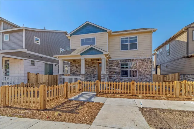 front view of a house with a small yard
