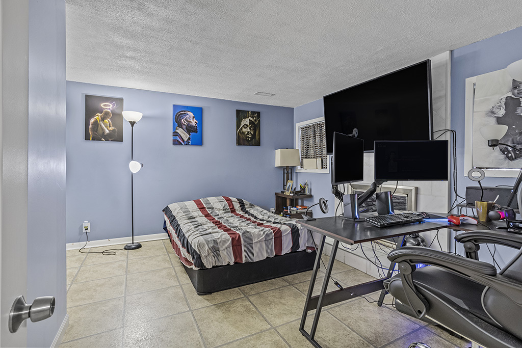 5113 Coulter Road Oak Forest, IL 60452 - Photo 13 of 13 a bedroom with a bed and a flat screen tv