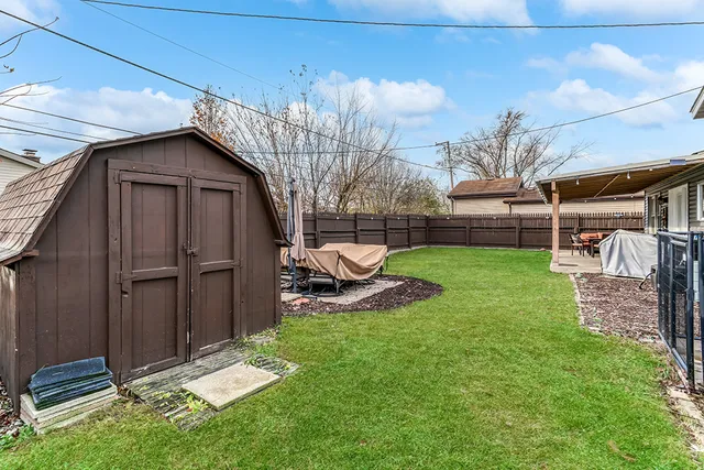 a view of a backyard with a sitting area