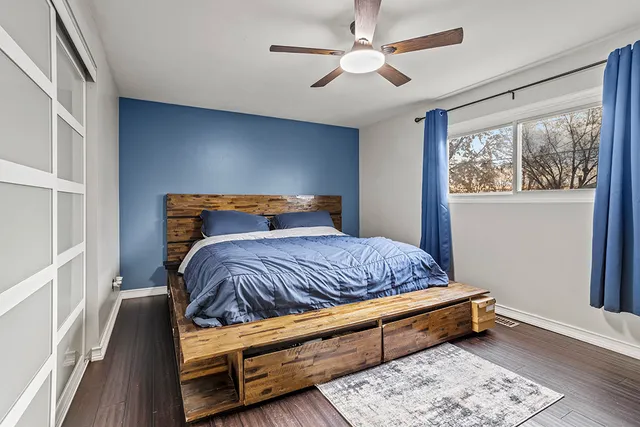 a bedroom with bed and window