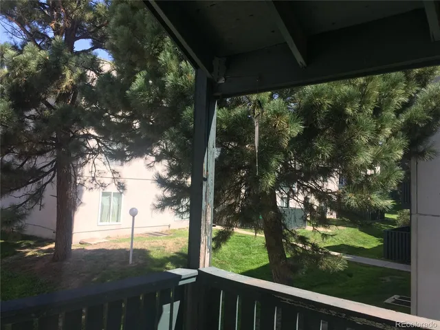 a view of a yard from a balcony