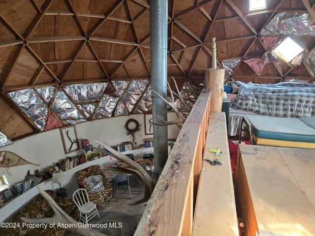 a bathroom with a toilet a sink and a window