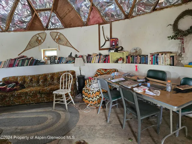 an aerial view of house with yard and entertaining space