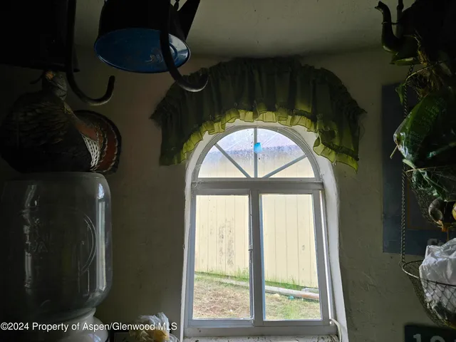 a view of a lush green hillside and a houses