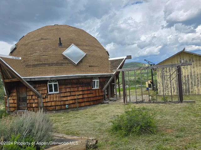 a view of a lush green space with sea
