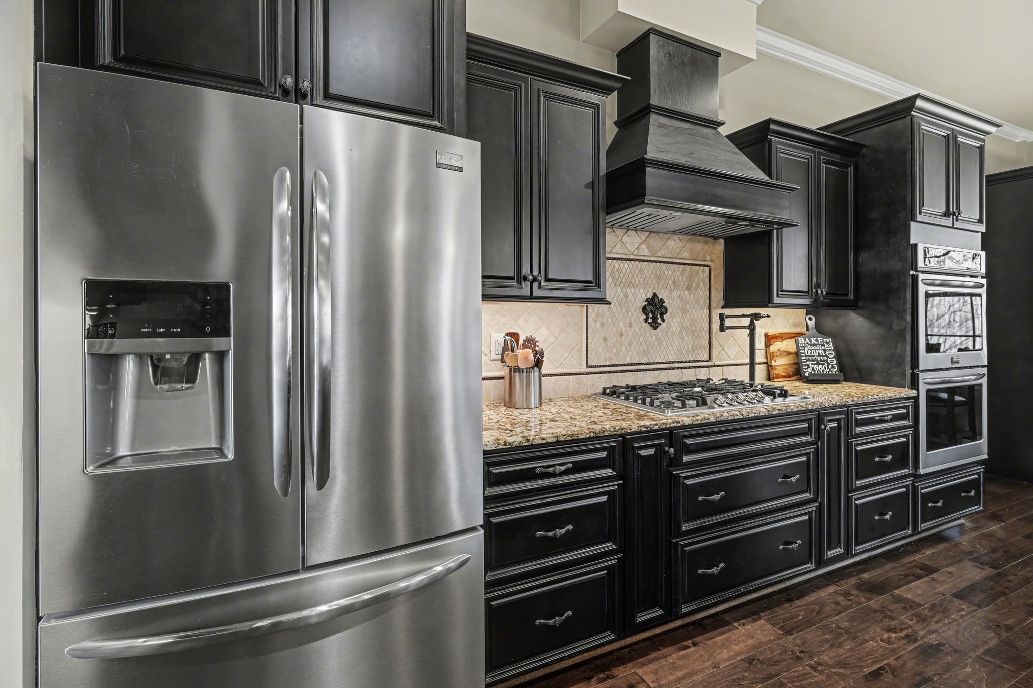 5094 Moss Road Nashville, TN 37221 - Photo 10 of 29 a kitchen with stainless steel appliances and refrigerator
