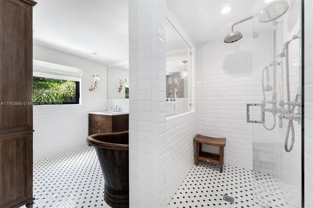 a bathroom with a sink a toilet and a shower