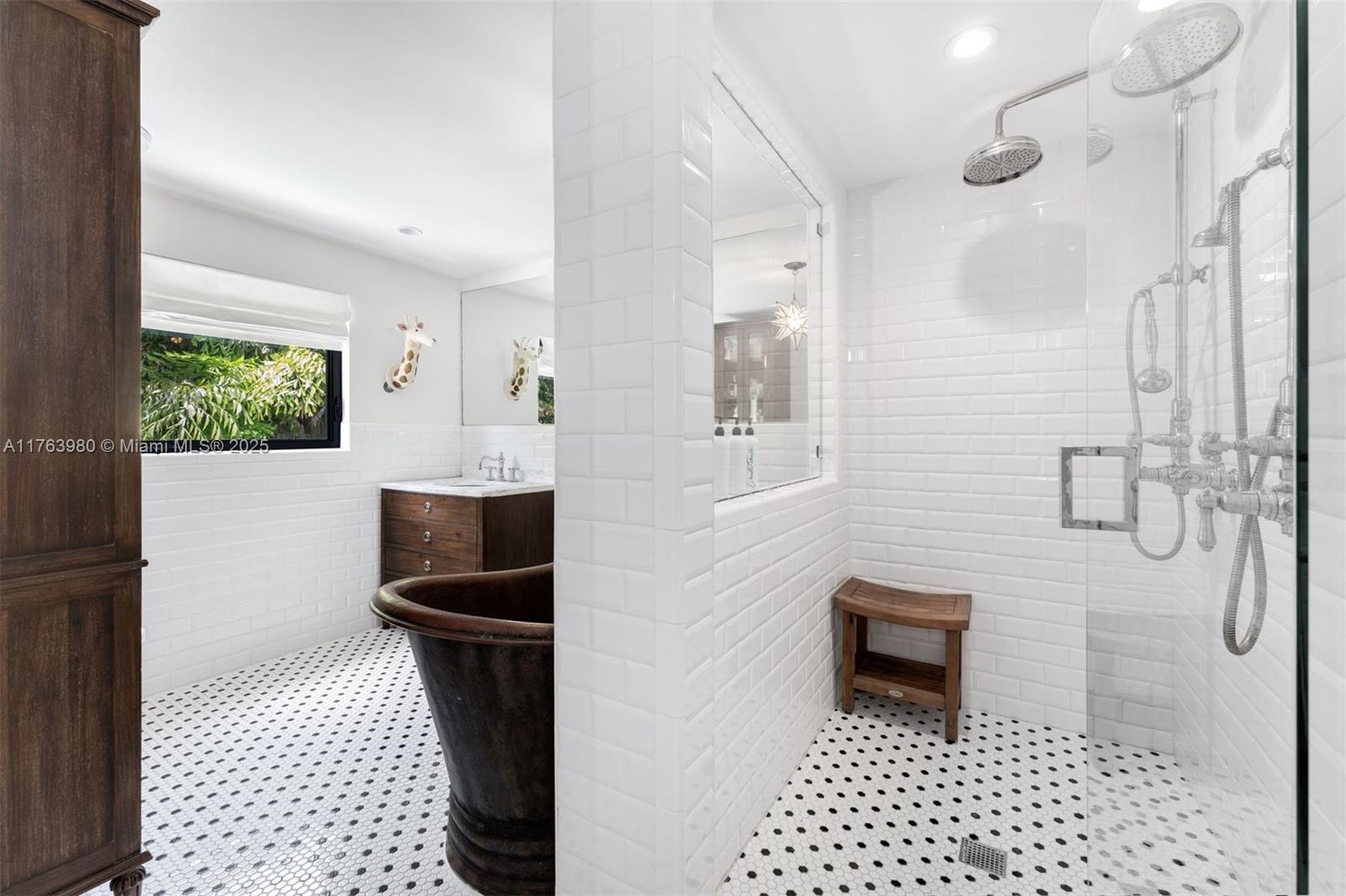 4430 Alton Road Miami Beach, FL 33140 - Photo 18 of 47 a bathroom with a sink a toilet and a shower