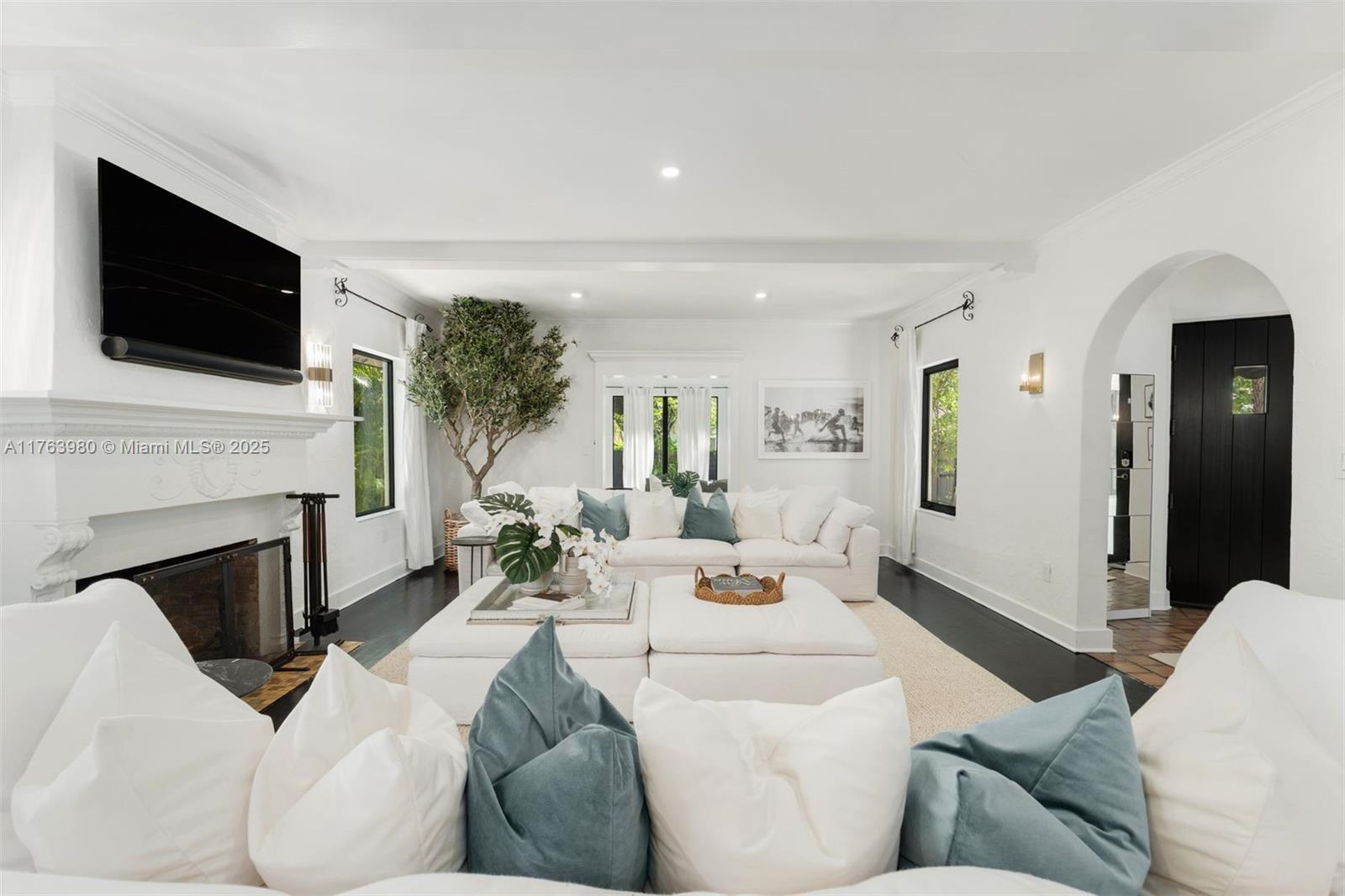 4430 Alton Road Miami Beach, FL 33140 - Photo 2 of 47 a living room with furniture fireplace and flat screen tv