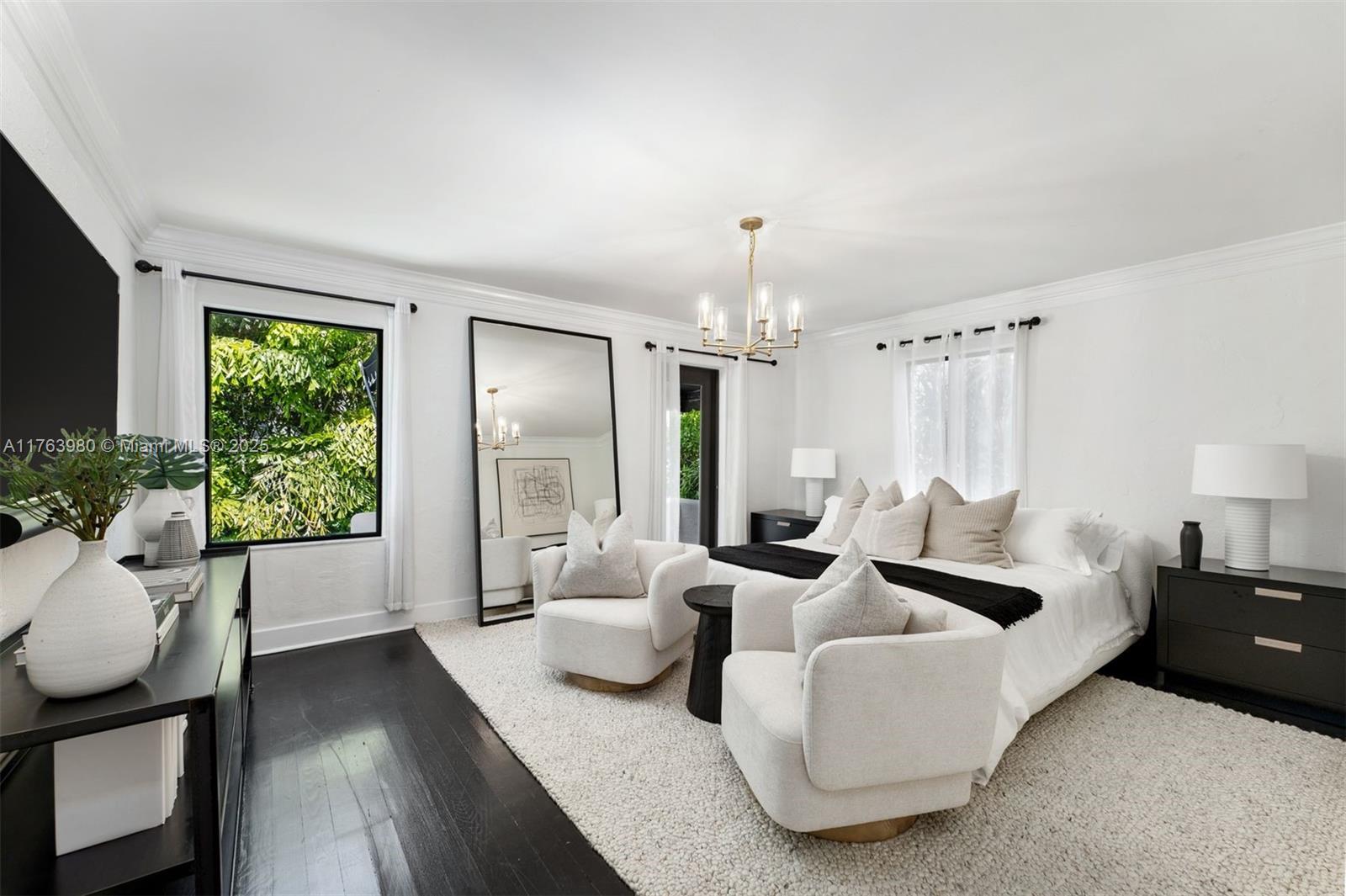 4430 Alton Road Miami Beach, FL 33140 - Photo 22 of 47 a living room with furniture and a large window